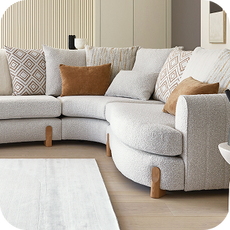 a white curved corner sofa