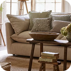 a heavily cushioned cream sofa