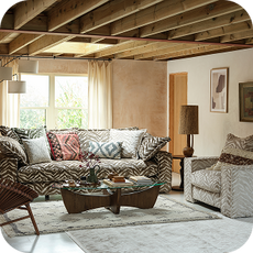 an animal print sofa with complementary furniture