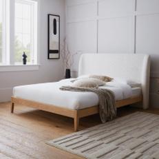 Cream boucle and oak bed frame with neutral accents