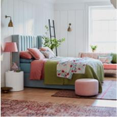 Blue bed with green and pink accessories
