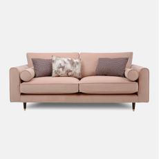 pink sofa with bolsters and patterned scatter cushions