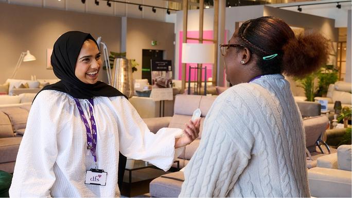 two people talking in a DFS store