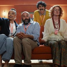 Experts grouped on a sofa