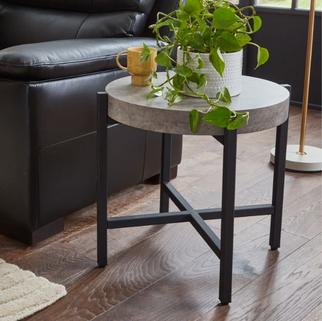 how to style a black sofa with orden side table