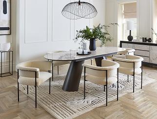 oval marble dining table with cream boucle dining chairs