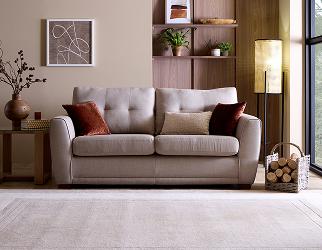 A cream sofa under cool lighting