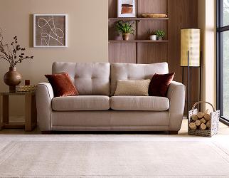 A cream sofa under neutral lighting