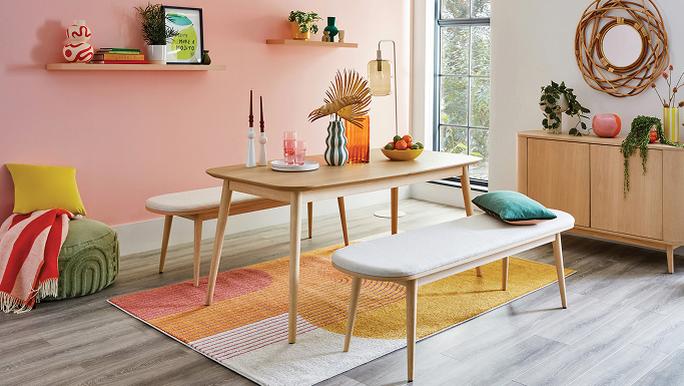 An oak dining set with bright rug