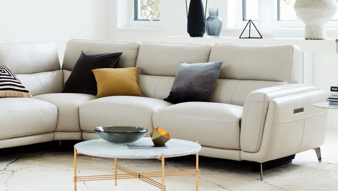 modern white leather recliner corner sofa with black and gold accents