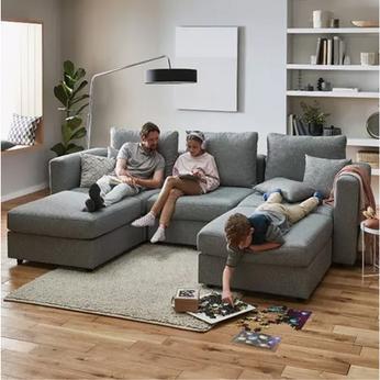 Family sat on a grey sofa