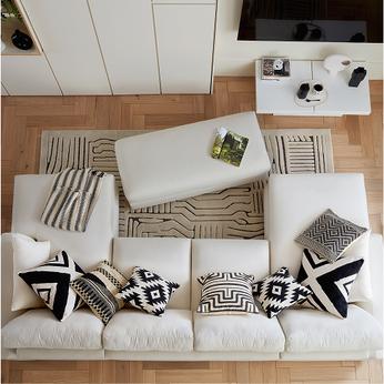 A top down view of a white u shaped sofa