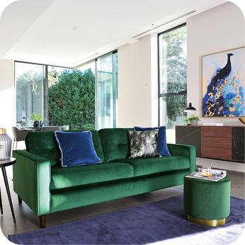 green sofa with blue rug