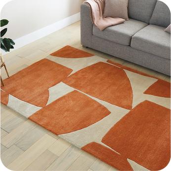 cream rug with orange geometric shapes