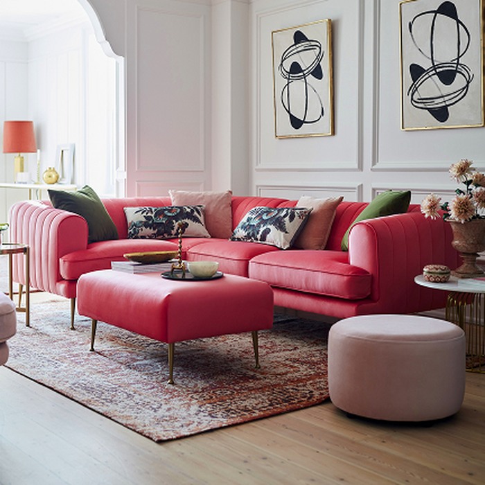 Barbiecore interior trend with enchanted sofa