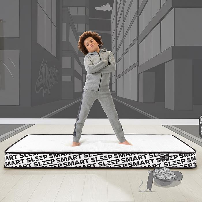 child stood on mattress crossing their arms