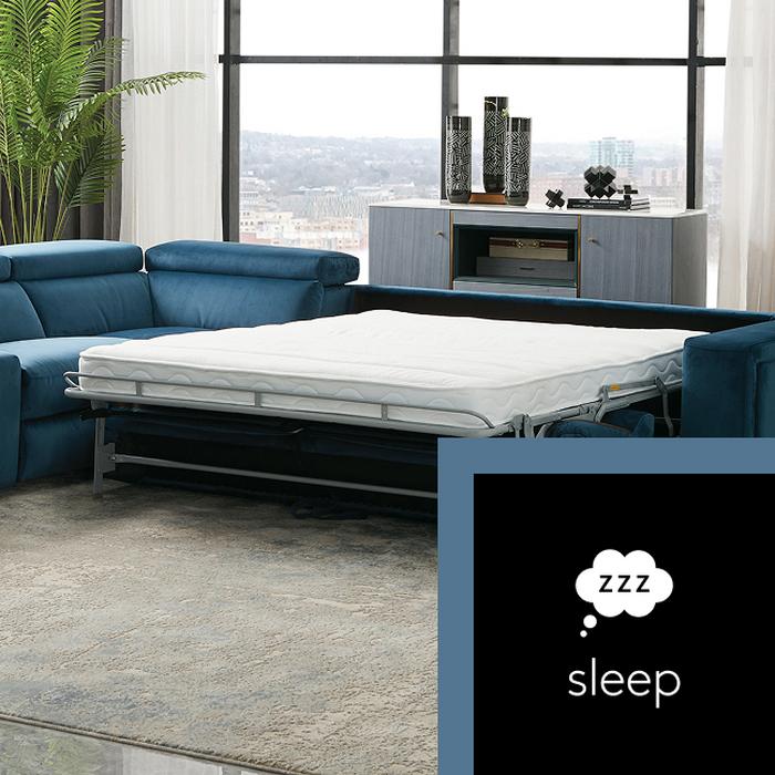 A blue corner sofa with the bed unfolded