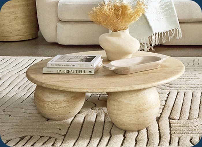 Travertine coffee table with black and white books 