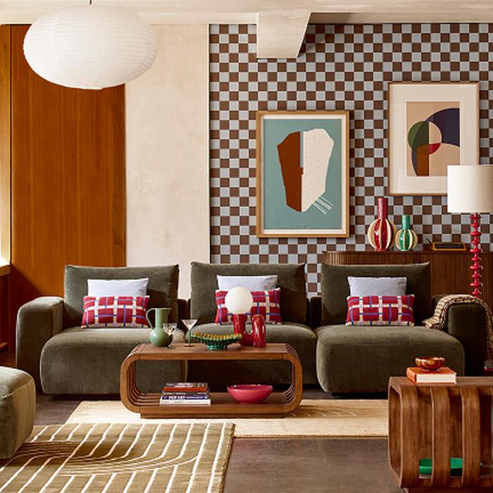 Green sofa with checkerboard wallpaper