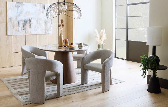 round table with grey fabric dining table