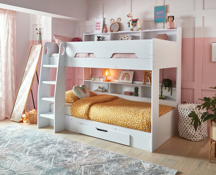 White kids bunk bed with pink wall backdrop