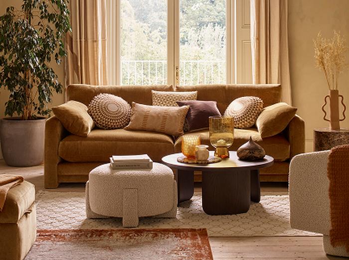 Burnt orange sofa with neutral accents