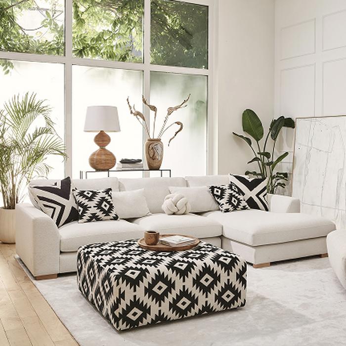 Calix ivory chaise sofa with white backdrop