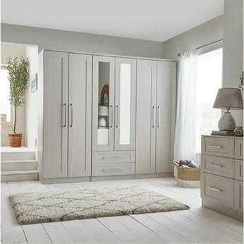 A large mirrored wardrobe in a grey room