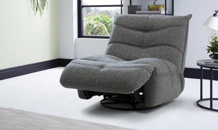 Dark grey swivel chair in a modern and bright living room with black furniture