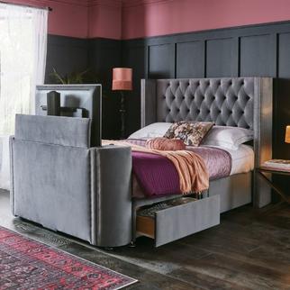 The Azalea TV bed with under bed drawer storage against a black panelled and pink wall