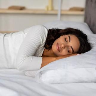 a young women sleeping on her side