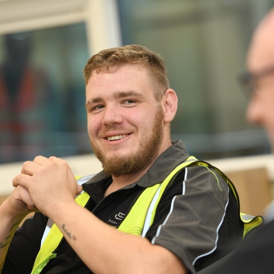 Man smiling in high vis vest