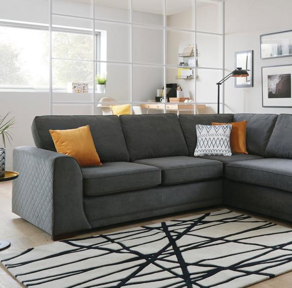 grey corner sofa with contrast mustard scatter cushions