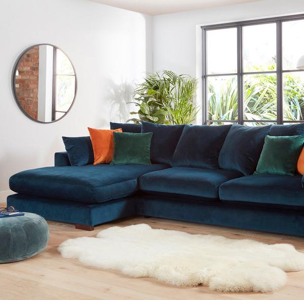 Teal chaise end sofa with fur rug infant