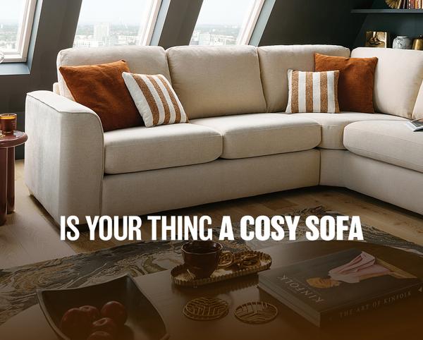 white corner sofa with brown scatter cushions