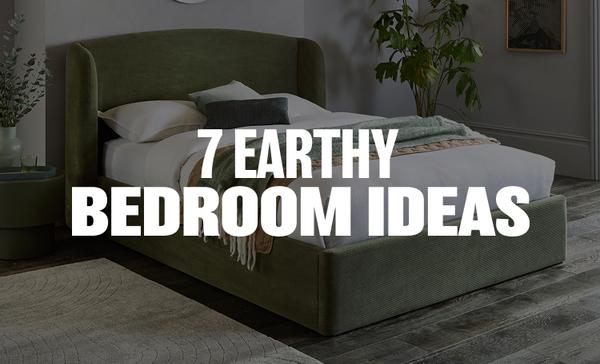 grey velvet bed in a earthy natural bedroom surrounded by plants