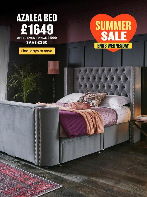 Grey tv bed with button back detail on headboard