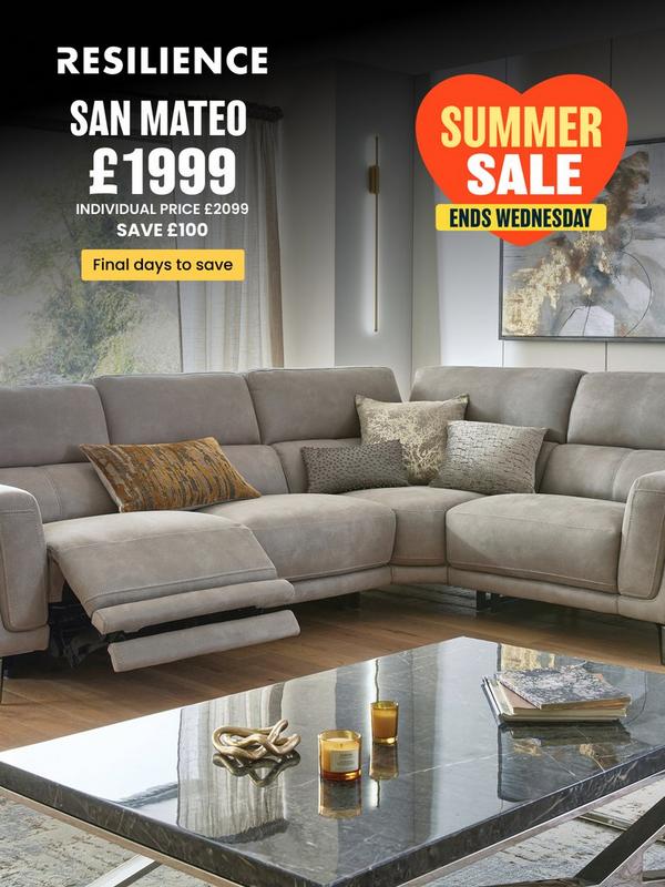 Stone coloured corner sofa with reclining features on footrest with selection of scatter cushions