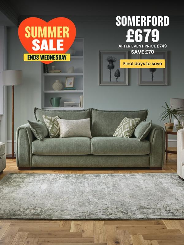 Sage green sofa with complimentary scatter cushions 