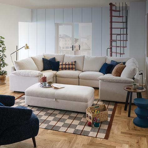 White u shaped sofa with long footstool