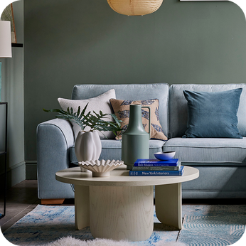 pale blue sofa with a wwhite coffee table