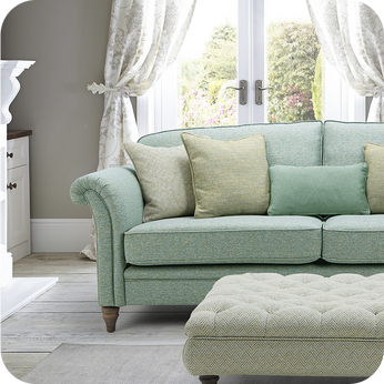 sage green chesterfield sofa with green scatter cushions