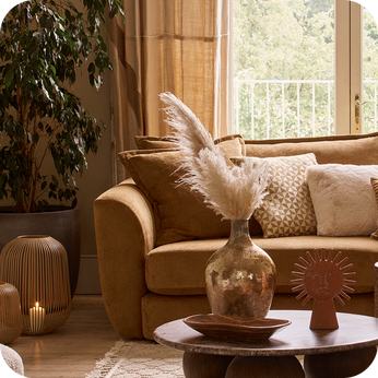 orange chenille sofa in a moody brown living room