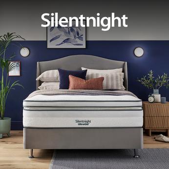 Silentnight Mattress on a grey divan bed against a blue wall