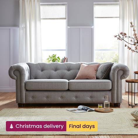 Grey sofa with pink scatter cushion