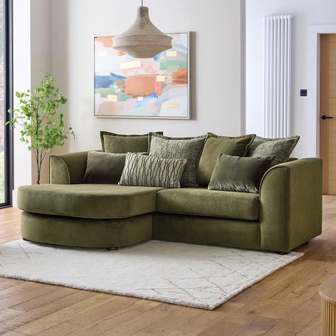Green modular sofa on a beige textured rug