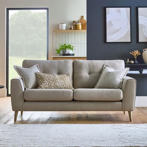 Green modular sofa on a beige textured rug