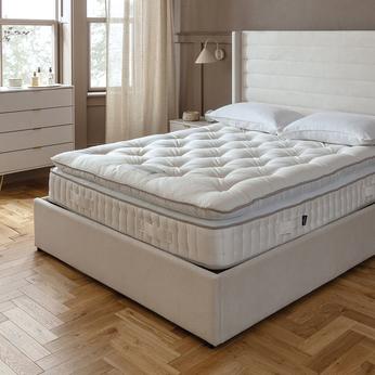 white ottoman divan bed with a harrison spinks mattress