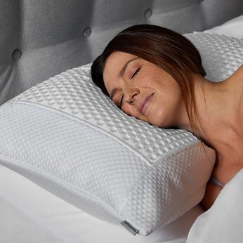 A close up of a women sleeping on a Silentnight pillow