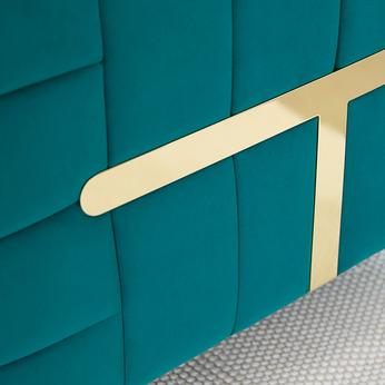Close up of a velvet teal seating with gold bar detailing